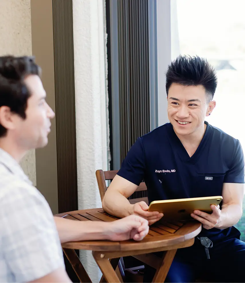 Dr. Zayn Endo with a patient
